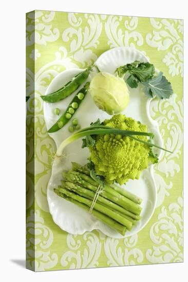 Assorted Green Vegetables on Porcelain Plate-Ulrike Koeb-Stretched Canvas
