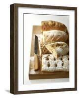 Assorted Loaves on Wooden Chopping Board-Michael Paul-Framed Photographic Print