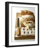 Assorted Loaves on Wooden Chopping Board-Michael Paul-Framed Photographic Print