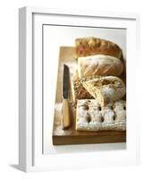 Assorted Loaves on Wooden Chopping Board-Michael Paul-Framed Photographic Print