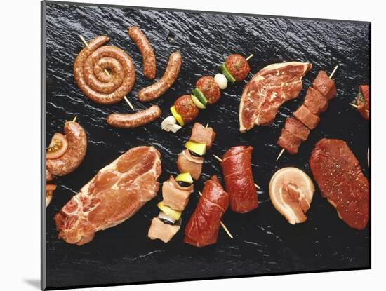 Assorted Meats and Sausages on Hot Stone Grill-Stefan Oberschelp-Mounted Photographic Print
