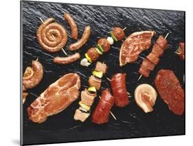 Assorted Meats and Sausages on Hot Stone Grill-Stefan Oberschelp-Mounted Photographic Print