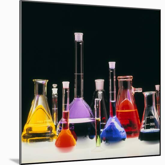 Assortment of Laboratory Flasks Holding Solutions-Tek Image-Mounted Premium Photographic Print