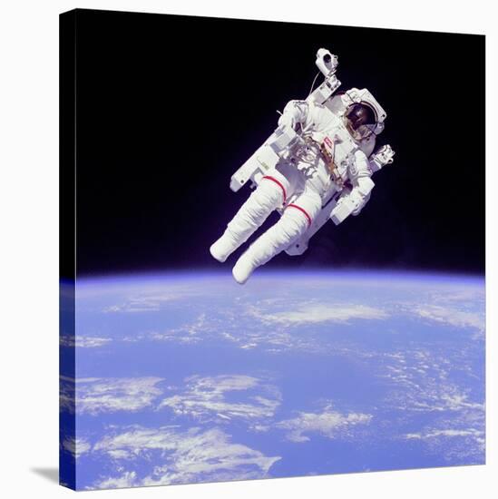 Astronaut Bruce Mccandless in Floating Weightless 320 Feet from the Space Shuttle Challenger-null-Stretched Canvas