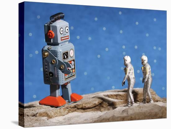 Astronaut Figurines Meeting Space Robot-null-Stretched Canvas