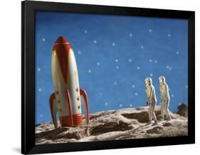 Astronaut Figurines Standing Beside Toy Rocket-null-Framed Photographic Print