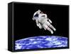 Astronaut Floating in Outer Space Above Planet Earth-null-Framed Stretched Canvas