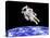 Astronaut Floating in Outer Space Above Planet Earth-null-Stretched Canvas