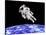 Astronaut Floating in Outer Space Above Planet Earth-null-Stretched Canvas