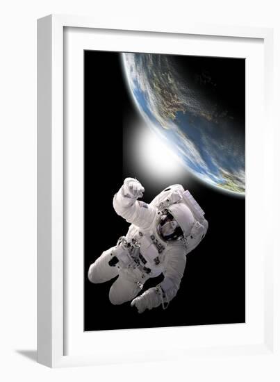 Astronaut Floating in Outer Space with Visible Sunrise from an Earth-Like Planet-Stocktrek Images-Framed Art Print