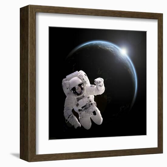 Astronaut Floating in Space as the Sun Rises on an Earth-Like Planet-Stocktrek Images-Framed Art Print