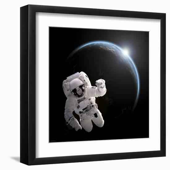 Astronaut Floating in Space as the Sun Rises on an Earth-Like Planet-Stocktrek Images-Framed Art Print