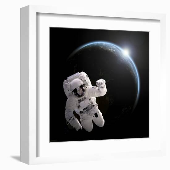 Astronaut Floating in Space as the Sun Rises on an Earth-Like Planet-Stocktrek Images-Framed Art Print