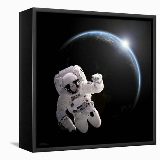 Astronaut Floating in Space as the Sun Rises on an Earth-Like Planet-Stocktrek Images-Framed Stretched Canvas