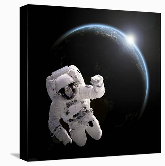 Astronaut Floating in Space as the Sun Rises on an Earth-Like Planet-Stocktrek Images-Stretched Canvas
