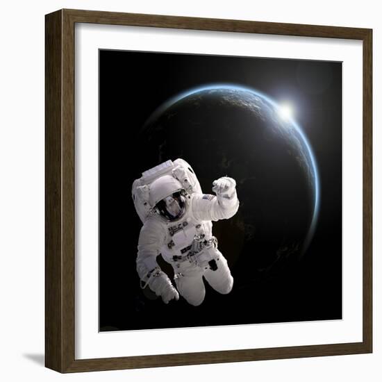 Astronaut Floating in Space as the Sun Rises on an Earth-Like Planet-Stocktrek Images-Framed Art Print