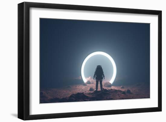 Astronaut on foreign planet in front of spacetime portal light-Michal Bednarek-Framed Art Print