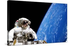 Astronaut Performing a Spacewalk-null-Stretched Canvas