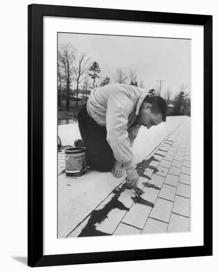 Astronaut Virgil I. Grissom Using Roof Cement at Home-Ralph Morse-Framed Premium Photographic Print