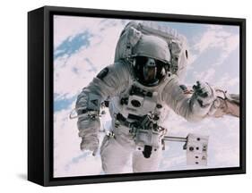 Astronaut Walking in Space-David Bases-Framed Stretched Canvas