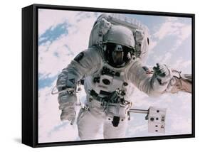 Astronaut Walking in Space-David Bases-Framed Stretched Canvas