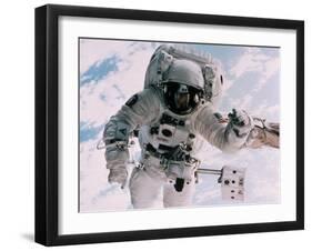 Astronaut Walking in Space-David Bases-Framed Premium Photographic Print