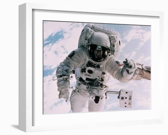 Astronaut Walking in Space-David Bases-Framed Premium Photographic Print