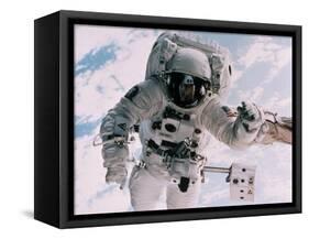 Astronaut Walking in Space-David Bases-Framed Stretched Canvas