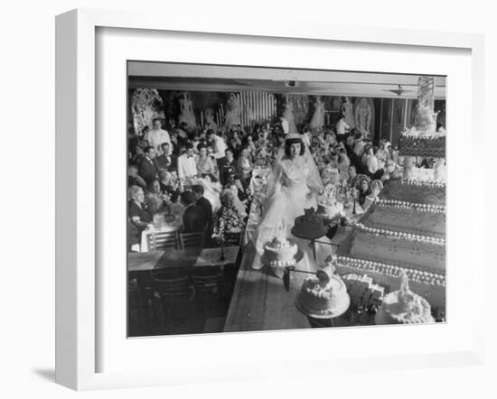 At Palumbo's Cafe, Bride Mrs. Salvatore Cannella Walks Onto Stage, Facing a Revolving Cake Display-Cornell Capa-Framed Photographic Print
