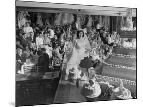 At Palumbo's Cafe, Bride Mrs. Salvatore Cannella Walks Onto Stage, Facing a Revolving Cake Display-Cornell Capa-Mounted Photographic Print