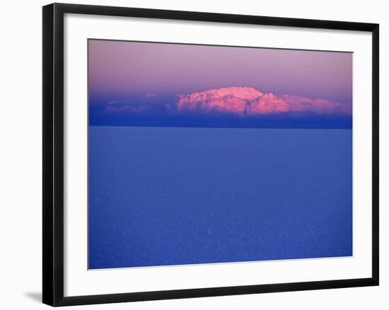 At Sunset a Cloud Is Painted Pink by the Last Rays of the Sun over the Salar De Uyuni, the Largest -John Warburton-lee-Framed Photographic Print