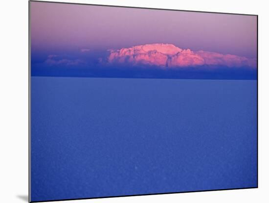 At Sunset a Cloud Is Painted Pink by the Last Rays of the Sun over the Salar De Uyuni, the Largest -John Warburton-lee-Mounted Photographic Print