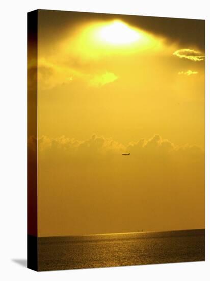 At Sunset a Commerical Jet Makes its Approach to Louis Armstrong New Orleans International Airport-null-Stretched Canvas