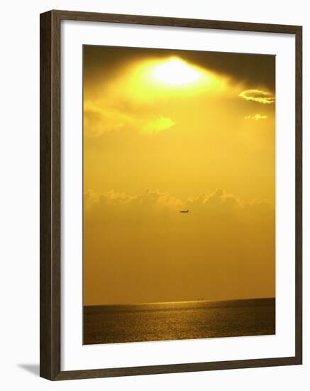 At Sunset a Commerical Jet Makes its Approach to Louis Armstrong New Orleans International Airport-null-Framed Photographic Print