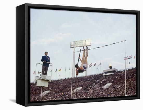 Athlete Clearing the Pole Vault at Summer Olympics-John Dominis-Framed Stretched Canvas