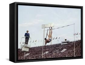 Athlete Clearing the Pole Vault at Summer Olympics-John Dominis-Framed Stretched Canvas