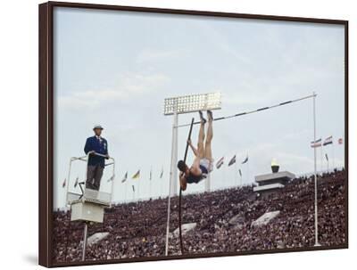 'Athlete Clearing the Pole Vault at Summer Olympics' Photographic Print