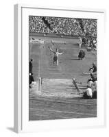 Athlete Competing in Long Jump-null-Framed Premium Photographic Print