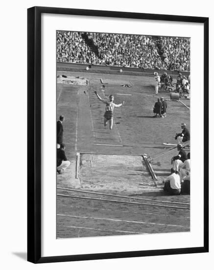 Athlete Competing in Long Jump-null-Framed Premium Photographic Print
