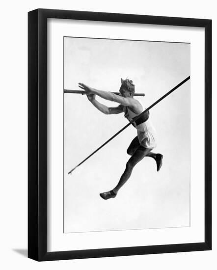 Athlete Doing a Dramatic Pole Vault in Preparation For the 1936 Olympics-null-Framed Photographic Print