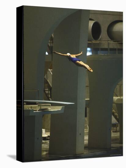 Athlete in Mid Air During a Platform Dive at Summer Olympics-Art Rickerby-Stretched Canvas