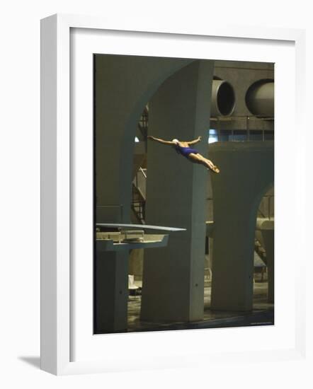 Athlete in Mid Air During a Platform Dive at Summer Olympics-Art Rickerby-Framed Photographic Print