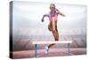 Athletic Woman Practicing Show Jumping against View of a Stadium-vectorfusionart-Stretched Canvas