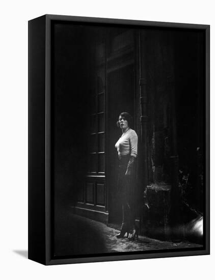 Atmospheric of Parisienne Prostitute Standing Near Doorway on Street-Alfred Eisenstaedt-Framed Stretched Canvas