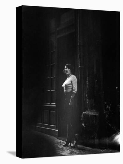 Atmospheric of Parisienne Prostitute Standing Near Doorway on Street-Alfred Eisenstaedt-Stretched Canvas