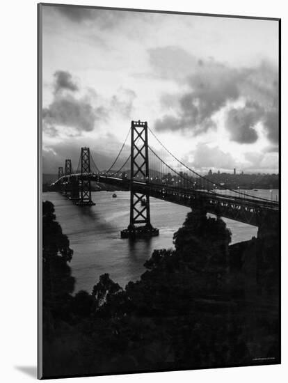 Atmospheric View of the San Francisco Oakland Bay Bridge Viewed from the Oakland Side at Dusk-null-Mounted Photographic Print