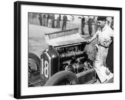 'Attilio Marinoni, Chief Mechanic of Scuderia Ferrari, with an Alfa