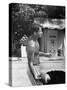 Attorney General Robert F. Kennedy Holding Football, with Dog Nearby, at His Swimming Pool-null-Stretched Canvas