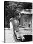 Attorney General Robert F. Kennedy Holding Football, with Dog Nearby, at His Swimming Pool-null-Stretched Canvas