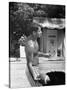 Attorney General Robert F. Kennedy Holding Football, with Dog Nearby, at His Swimming Pool-null-Stretched Canvas